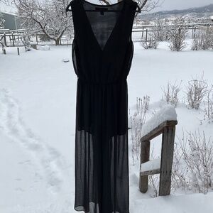 Simple yet elegant semi transparent wide legged black jumpsuit By XXI